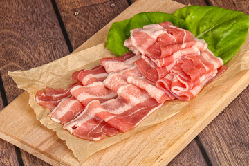 Sliced pork bacon in the bowl