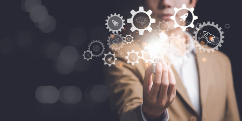 Businessman showing creative ideas in his hands ,creative thinking ,ideas and innovation ,Connecting creativity with modern technology ,Finding new solutions to solve business problems