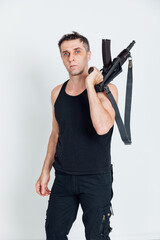 Fototapeta na wymiar a man with a gun standing on a white background