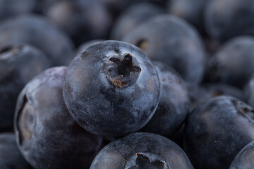 Blueberries on stone plate background