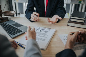 Businessmen and lawyers discuss contract documents. sign a business contract