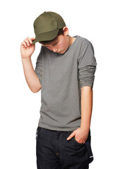 Fashion, cool and a shy teenager with a cap isolated on a white background in a studio. Serious,...