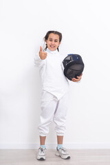 Little girl fencer with epee and mask