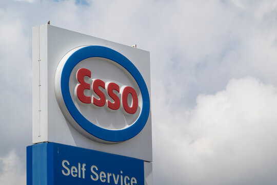 Calgary, Alberta, Canada. May 9, 2023. An Esso Self Service Gas station sign on a cloudy day.