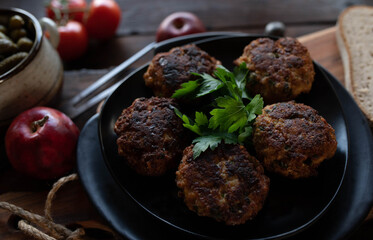 Frikadeller, traditional pork meatballs with bread and pickles