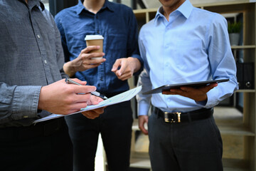Cropped image of businesspeople discussing startup project, sharing business ideas during coffee break