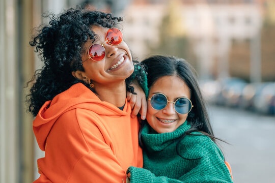 friends on the street laughing out loud