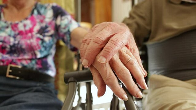 seniors who love each other hold hands