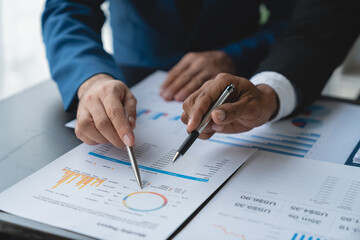 Modern business people meeting with startup projects pointing to discussion calculations and analysis Charts and graphs of finance, business and accounting data. teamwork concept.