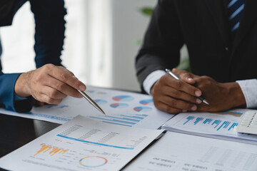 Modern business people meeting with startup projects pointing to discussion calculations and analysis Charts and graphs of finance, business and accounting data. teamwork concept.