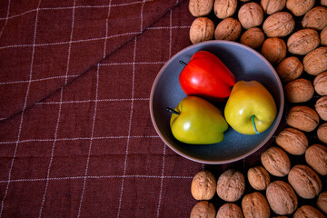 Walnuts with apples lie on the table. Healthy nutrition and healthy lifestyle.