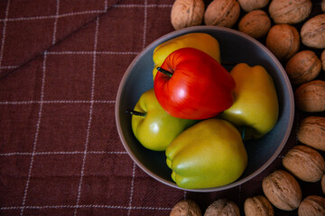 Walnuts with apples lie on the table. Healthy nutrition and healthy lifestyle.