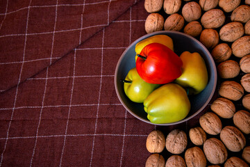 Walnuts with apples lie on the table. Healthy nutrition and healthy lifestyle.