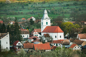 Rimetea is a small village located in Transylvania, Romania. It is situated in the Apuseni Mountains and is known for its picturesque setting and well preserved Hungarian architectural style.