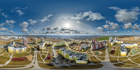 Fototapeta na wymiar aerial seamless spherical hdri 360 panorama view above modern residential complex with high-rise buildings in town in equirectangular projection.