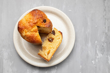 Delicious Panettone slice with candied fruits on dish