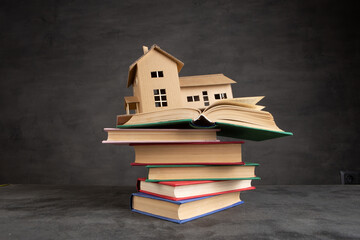 House model, gavel and books on the desk, Real property law concept, real estate auction - 601021032