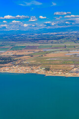 View from a flying plane on Fiumicino bay and the Tyrrhenian sea, Italy