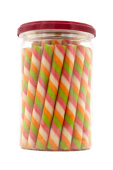 Wafer stick roll in transparent jar isolated on white background. colorful wafer stick rolls.