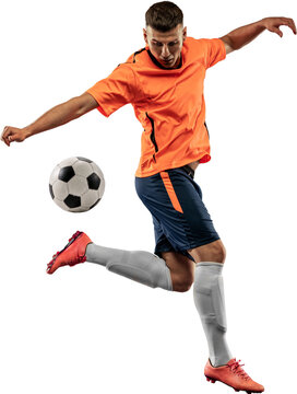 Young man, professional football player in motion, training, playing isolated over transparent background. Ball dribbling. Concept of sport, competition, action and motion, lifestyle