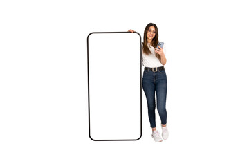 Using mobile phone while leaning big smartphone mockup. Full body length caucasian young woman...