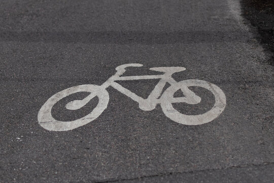 sign on the road that says bike lane