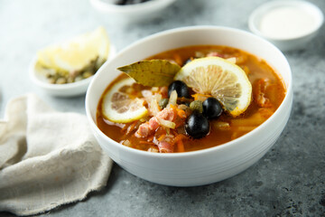 Traditional homemade soup with sausage and capers