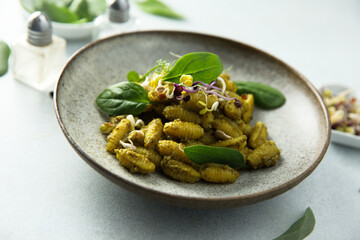 Homemade pasta with spinach pesto