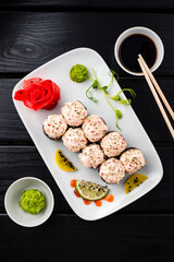 Sushi rolls with white fish, crab meat, cream cheese, avocado, wasabi, ginger and soy sauce.