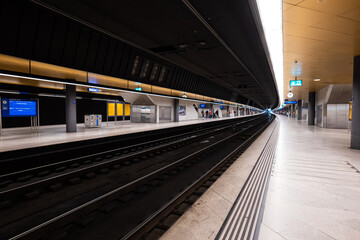 Zurich city central train station. Underground train station, wide-angle view, artificial illumination, unrecognizable people