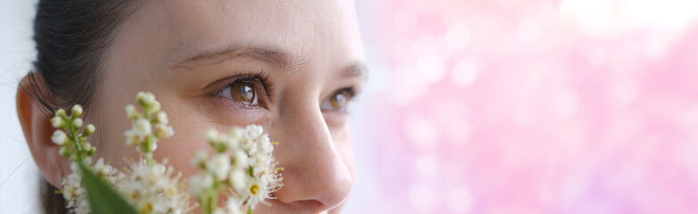close up part of woman's face in flowers, beautiful girl 30 years old, human eyes looking to side,...