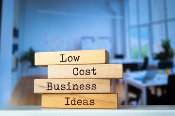 Wooden blocks with words 'Low-Cost Business Ideas'.