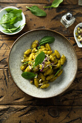 Homemade pasta with spinach pesto