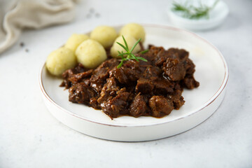 Homemade beef ragout with potato dumplings