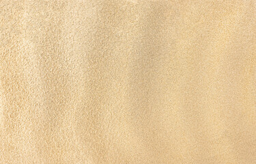 Sand. Texture, surface of sea sand. Natural background. Waves of sand. Seascape. Dunes. Copy space
