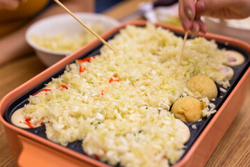 Making takoyaki, Octopus ball at home in the evening