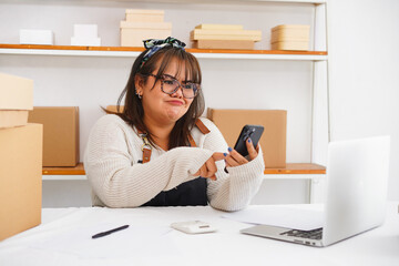 Expression asian woman self employed  getting email with bad news about debt bankruptcy service 