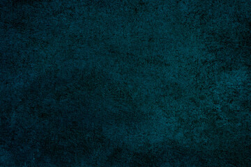 Dark rough surface with a bluish tint. Wall texture. Abstract dark background.