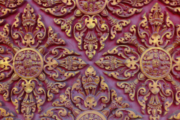 The texture of the pattern on the wall of the Cambodian Buddhist temple.