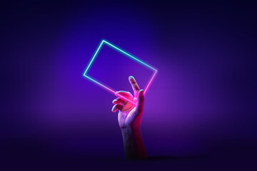 Human hand interacting with geometric glowing figure, rectangle over abstract minimal violet background in neon light