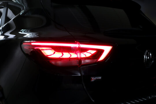 nice design led tail light or tail lamp of black suv car brand MG ZS model park in the dark garage during checking and maintenance process