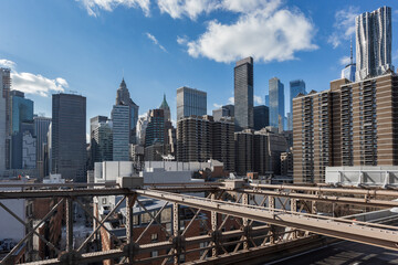 Manhattan skyline from the Brooklyn bridge with deep blue sky