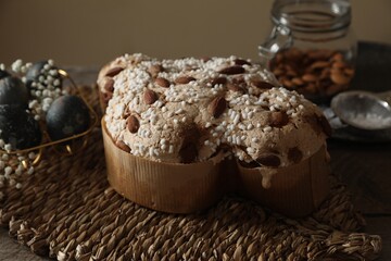 Fototapeta premium Delicious Italian Easter dove cake (traditional Colomba di Pasqua) on wooden table