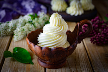 Sweet dessert: delicate creamy cream in a beautiful cup. Put the vanilla cream on a plate....
