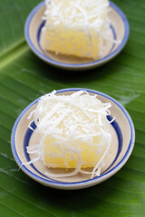 Steamed tapioca cake or cassava cake with grated coconut
