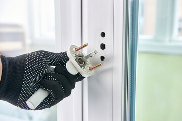 The handle is screwed to the window frame. Maintenance of metal-plastic windows.