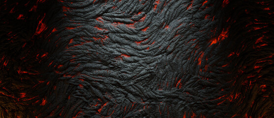 Abstract waves come to the surface with a gap of lava between the rock waves. The surface of molten lava and fossilized lava.