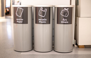 Modern metal cylinder trashcan or bin which separate the type of garbage put on at the public area, department store.