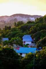 House in the mountains and green forests landscape with South Asian Architecture at Thailand, Vertical Photo