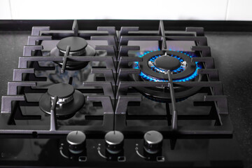 glass-ceramic built-in black hob with included gas burner with three levels of gas supply. Gas consumption and savings in the household